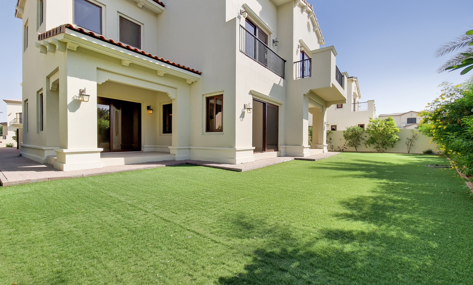 mansion with green yard